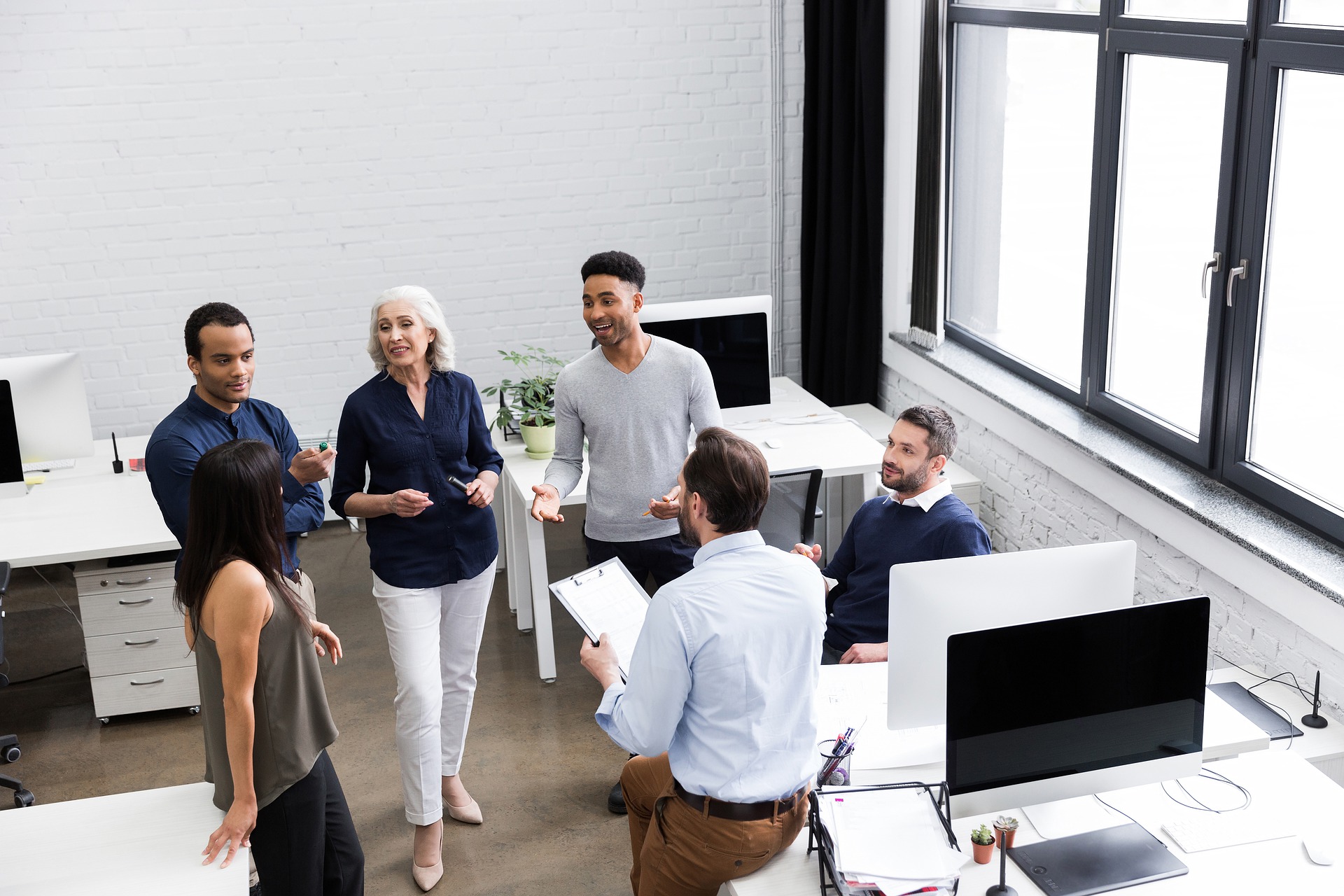 group of people meeting to dicuss work topic